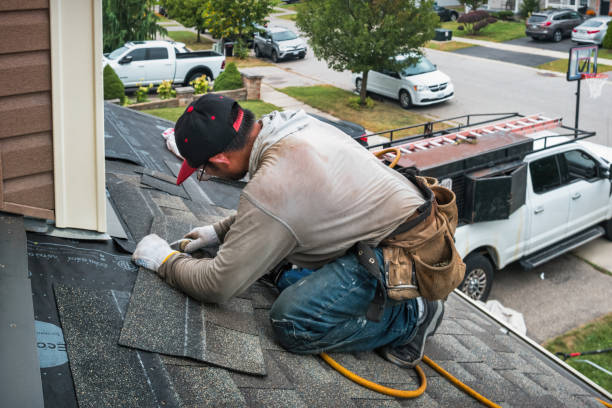 Professional Roof Replacement technician working in Pine Island, NY